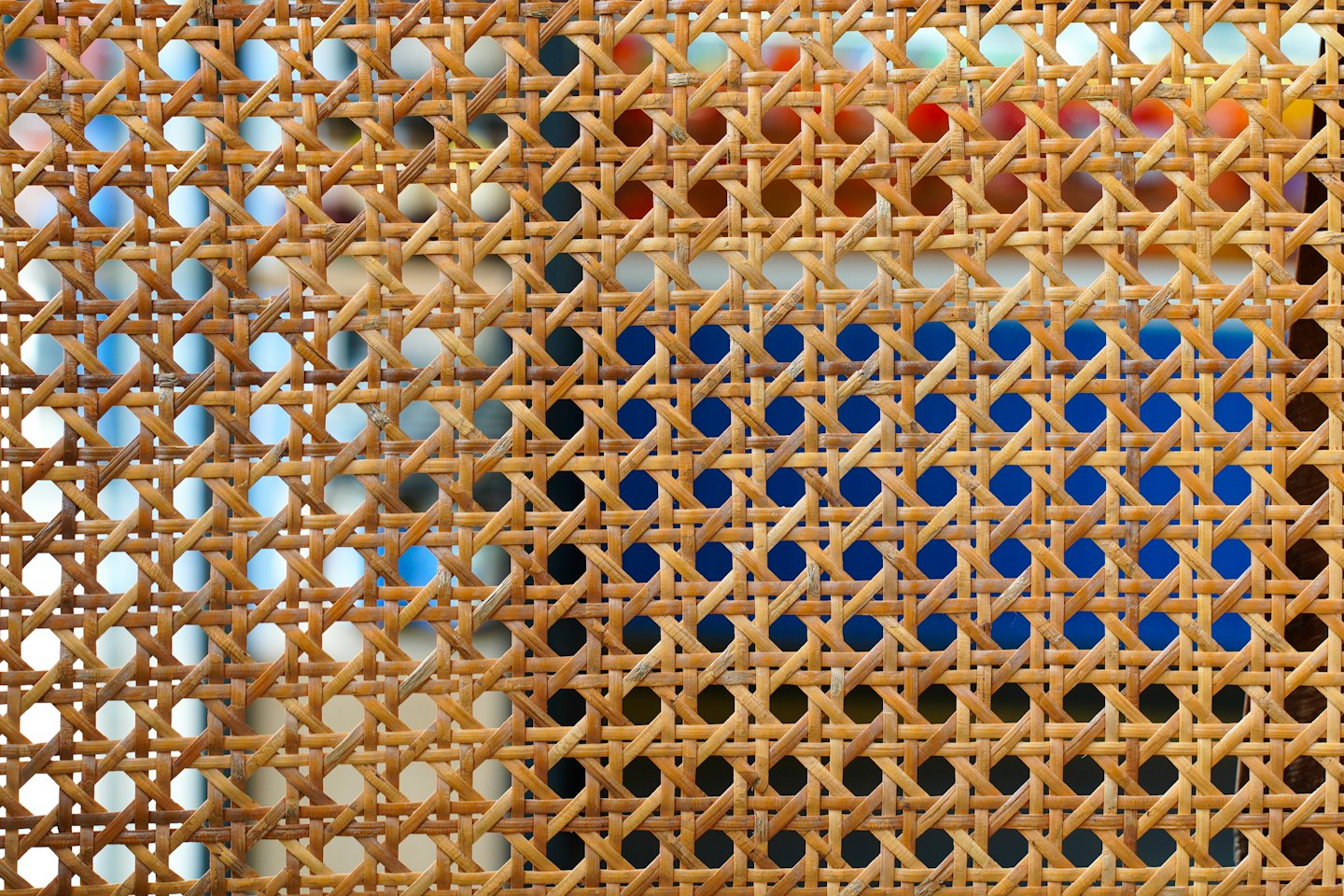 Intricate pattern of woven natural cane fibers.